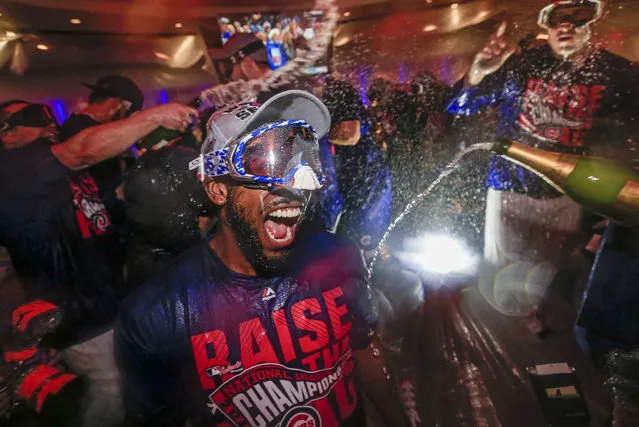 Chicago Cubs players celebrate after defeating the Los Angeles Dodgers in game six of the National League Championship Series (NLCS) at Wrigley Field in Chicago, Illinois, USA, 22 October 2016. The Cubs will face the Cleveland Indians of the American League in the World Series. (Photo by Tannen Maury/EPA)