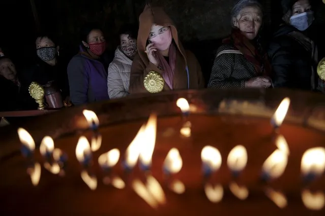 Pilgrims wait to enter the Jokhang Temple in central Lhasa, Tibet Autonomous Region, China November 20, 2015. (Photo by Damir Sagolj/Reuters)