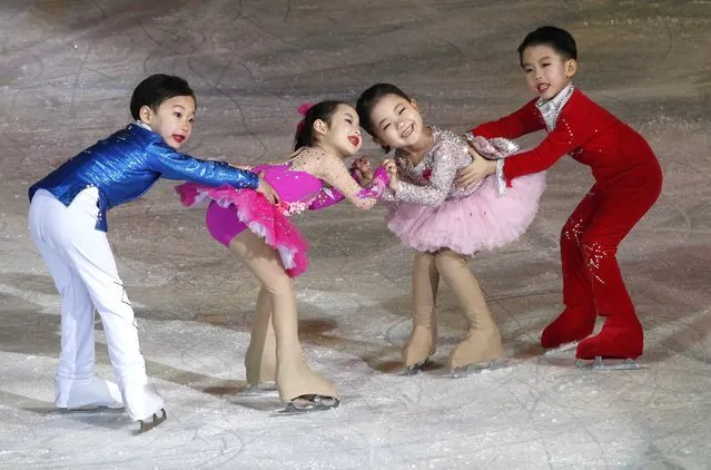 Young figure skaters perform during a festival celebrating the upcoming birthday of leader Kim Jong Il in Pyongyang, North Korea, Wednesday, February 14, 2018. Kim Jong Il was born on February 16, 1941. (Photo by Jon Chol Jin/AP Photo)