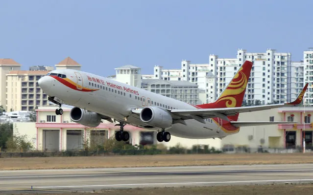A Hainan Airlines plane takes off from the Sanya Phoenix International Airport in Sanya, Hainan province, China, May 1, 2015. (Photo by Reuters/Stringer)