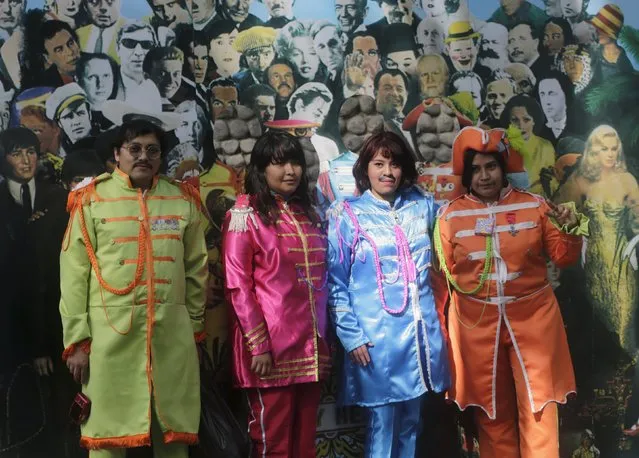 People dressed as The Beatles pose during an attempt to set a Guinness World Record of the largest number of people dressed as The Beatles, at a park in Mexico City, Mexico November 28, 2015. (Photo by Henry Romero/Reuters)