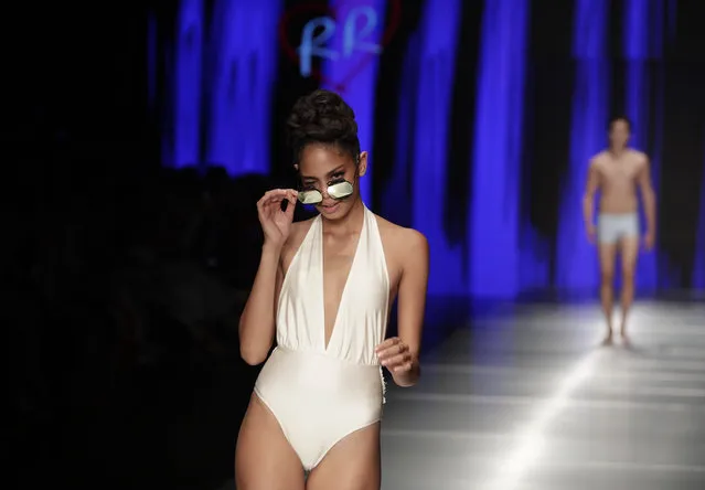 A model walks down the runway wearing swimwear designed by Rene Ruiz during Miami Fashion Week, Thursday, May 31, 2018, in Miami. (Photo by Lynne Sladky/AP Photo)