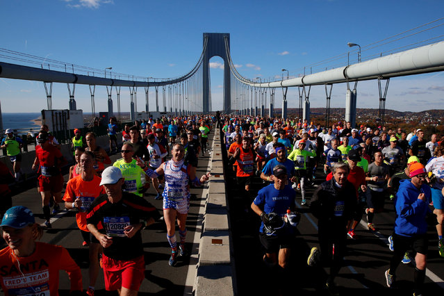 Runners cross the Verrazano–Narrows Bridge during the 2016 New York City Marathon in the Manhattan borough of New York City, NY, U.S. November 6, 2016. (Photo by Brendan McDermid/Reuters)