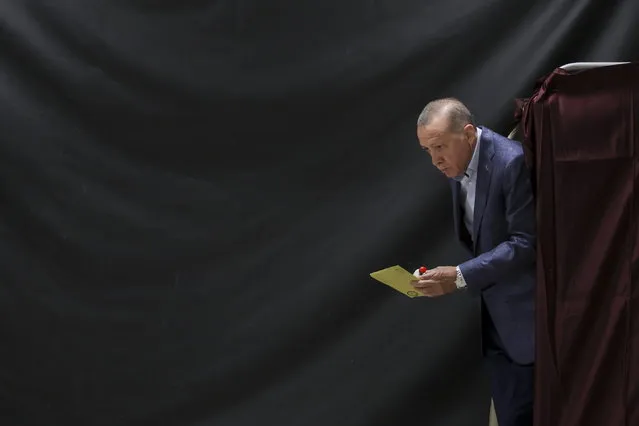 Turkish President Tayyip Erdogan walks out of a voting booth at a polling station in Istanbul, Turkey 14 May 2023, as the country holds simultaneous parliamentary and presidential elections. (Photo by Umit Bektas/Pool via EPA)