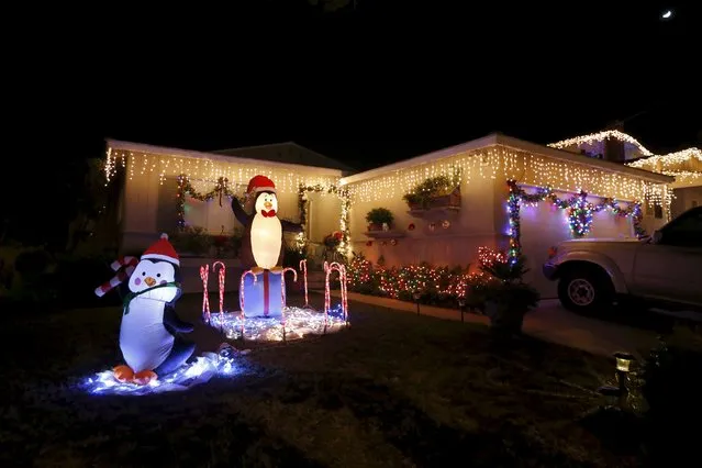 Holiday lights are seen on a home in the Sleepy Hollow area of Torrance, California, United States, December 15, 2015. (Photo by Lucy Nicholson/Reuters)