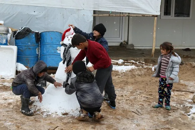 Displaced children from the minority Yazidi sect, fleeing violence in the Iraqi town of Sinjar play at a refugee camp in Duhok province January 2, 2016. (Photo by Ari Jalal/Reuters)