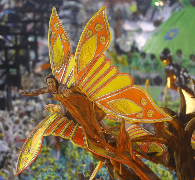 A reveller from the Viradouro samba school participates in the annual carnival parade in Rio de Janeiro's Sambadrome, February 15, 2015. (Photo by Ricardo Moraes/Reuters)