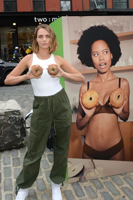 English model and actress Cara Delevingne gets playful with bagels at the Aerie Hidden Gems Marketplace in New York on August 15, 2023. (Photo by Michael Simon/Startraks Photo)