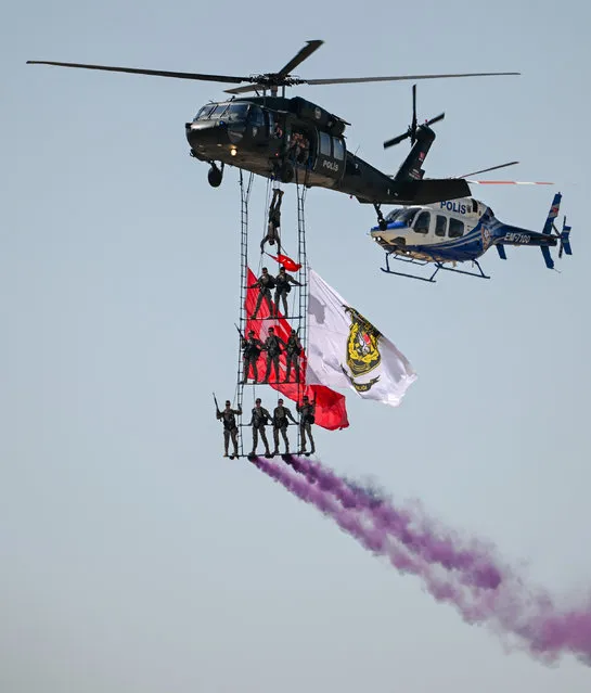 Police Special Operations teams perform during the Turkiye's largest technology and aerospace event TEKNOFEST in Ankara, Turkiye on August 30, 2023. The five-day event will feature competitions, air shows, exhibitions and workshops. The event has been organized by the Turkish Technology Team (T3) Foundation and the Turkish Industry and Technology Ministry jointly since 2018, in cooperation with dozens of ministries, public institutions, private firms, and universities. (Photo by Mustafa Ciftci/Anadolu Agency via Getty Images)