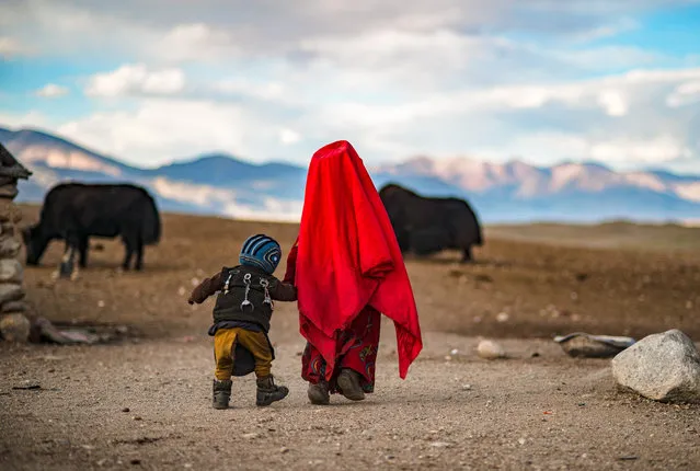 Nomadic Pamir Kyrgyz children herders in the isolated mountain valleys of northeastern Afghanistan. “Children are a rare gift”, as the saying goes among Afghan Kyrgyz. In the Pamir, the back of children are pinned with talismans for their health at times when good care becomes useless. During winter, the harsh climate is marked with lows reaching easily –40° C and summers are made of only two months over 0° C. (Photo by Tobias Marschall/Courtesy Photo)