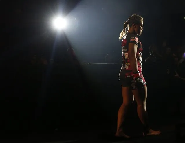 Malaysia's Ann Osman prepares to enter the cage for her mixed martial arts (MMA) ONE Championship fight against Egypt's Walaa Abbas in Kuala Lumpur, March 13, 2015. (Photo by Olivia Harris/Reuters)