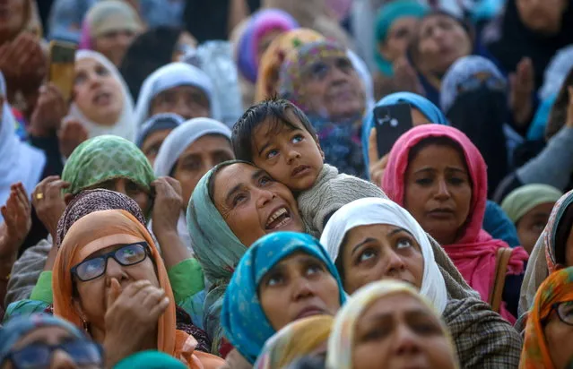 Muslims pray as the head priest (not pictured) displays the holy relic of the Prophet Muhammed on Eid-e-Milad-u-Nabi, the birthday of the Prophet Muhammad, at the Hazratbal Shrine in Srinagar, Kashmir, India, 29 September 2023. Thousands of devotees gathered at the Hazratbal Shrine, which houses a relic believed to be a hair from the beard of Prophet Muhammed (PBUM), to offer special prayers on the occasion of the Prophet's birth anniversary. (Photo by Farooq Khan/EPA)