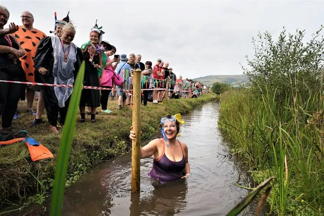 Sian Andrews takes part in the Rude Health World Bogsnorkelling Championships at Waen Rhydd peat bog in Llanwrtyd Wells, Wales on Sunday, August 28, 2022. (Photo by Joe Giddens/PA Images via Getty Images)