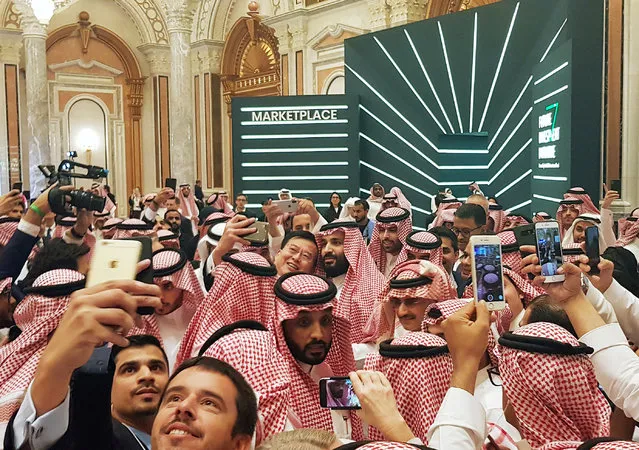 Saudi Arabia's Crown Prince Mohammed bin Salman poses for a selfie during the Future Investment Conference in Riyadh, Saudi Arabia, October 23, 2018. (Photo by Stephen Kalin/Reuters)