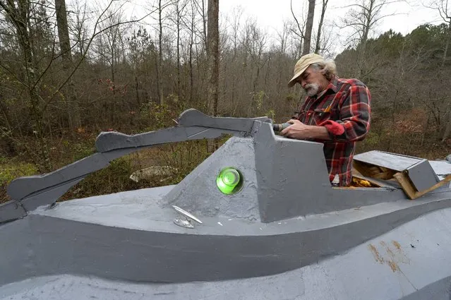 Danny McWilliams, 56, works on his 36-foot-long replica of Walt Disney movie version of the Nautilus submarine from Jules Verne's “20,000 Leagues Under the Sea” at his rural home in Ellijay, Georgia, USA, 04 December 2013. (Photo by Erik S. Lesser/EPA)