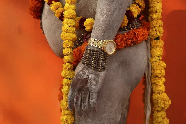 A Naga Sadhu, or a naked Hindu holy man of the Anand Akhada group, participates in a religious procession towards the Sangam, the confluence of rivers Ganges, Yamuna and mythical Saraswati, as part of the Kumbh festival in Allahabad, India, Friday, January 4, 2019. Millions of Hindu pilgrims are expected to take part in the large religious congregation on the banks of Sangam during the Kumbh festival in January 2019. (Photo by Rajesh Kumar Singh/AP Photo)