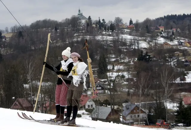 Participants wearing vintage attire use a ski lift before a traditional historical ski race in the northern Bohemian town of Smrzovka, Czech Republic, February 20, 2016. (Photo by David W. Cerny/Reuters)