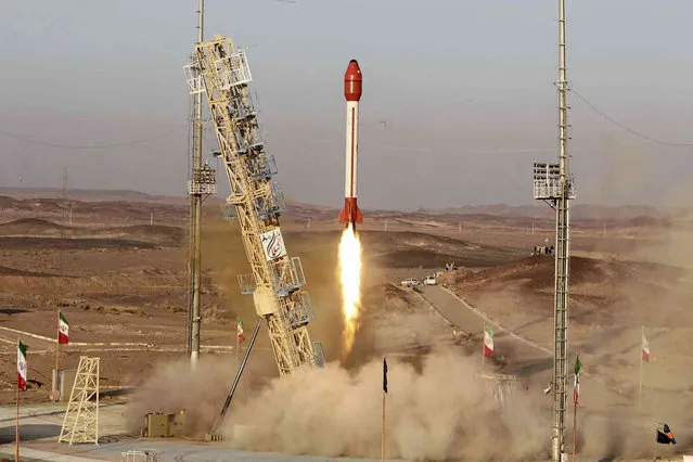 This photo released by the Iranian Defense Ministry on Wednesday, December 6, 2023, claims to show a rocket with a capsule carrying animals is launched from an undisclosed location into orbit, Iran. Iran said Wednesday it sent a capsule into orbit carrying animals as it prepares for human missions in coming years. (Photo by Iranian Defense Ministry via AP Photo)