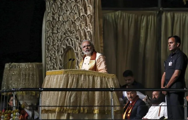 India's Prime Minister Narendra Modi addresses the gathering at the venue of World Culture Festival on the banks of the river in New Delhi, India, March 11, 2016. (Photo by Adnan Abidi/Reuters)