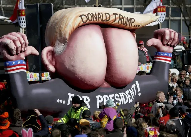 A carnival float with papier-mache caricature mocking US Republican presidential candidate Donald Trump, is displayed at a postponed “Rosenmontag” (Rose Monday) parade, at one location in Duesseldorf, Germany, March 13, 2016, after the original parade in February was cancelled due to severe weather. (Photo by Ina Fassbender/Reuters)
