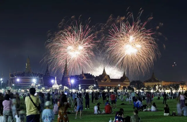 Fireworks explode over the Grand Palace during the New Year celebrations, in Bangkok, Thailand on December 31, 2023. (Photo by Athit Perawongmetha/Reuters)