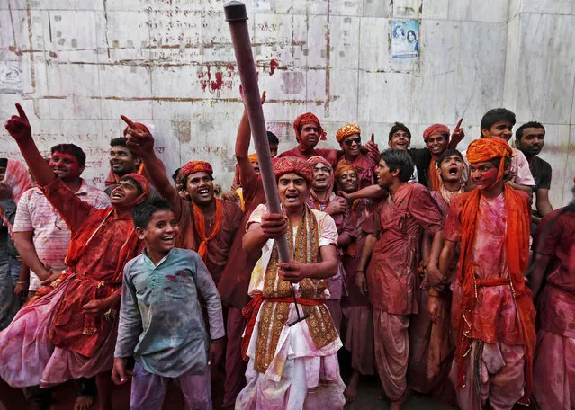 Men daubed in coloured powder shout as they celebrate “Lathmar Holi” at Nandgaon village, in the northern Indian state of Uttar Pradesh, March 10, 2014. (Photo by Adnan Abidi/Reuters)