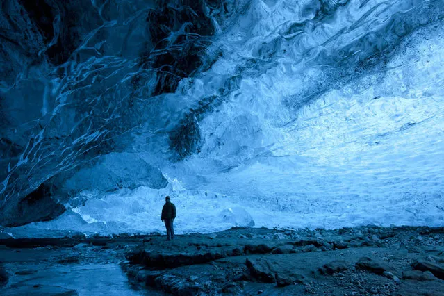 A wide view of Rob Lott in the crystal ice cave in the Vatnajokull Glacier, Iceland. (Photo by Rob Lott/Barcroft Media)