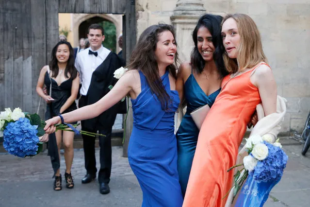 Students from Cambridge University make their way home along Trinity Lane after celebrating the end of the academic year at a May Ball in Trinity College on June 18, 2019. (Photo by Vantage News)
