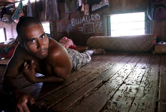 A prisoner lies on his bed inside the sleeping dormitory of a prison located on Kiritimati Island, part of the Pacific Island nation of Kiribati, April 5, 2016. (Photo by Lincoln Feast/Reuters)