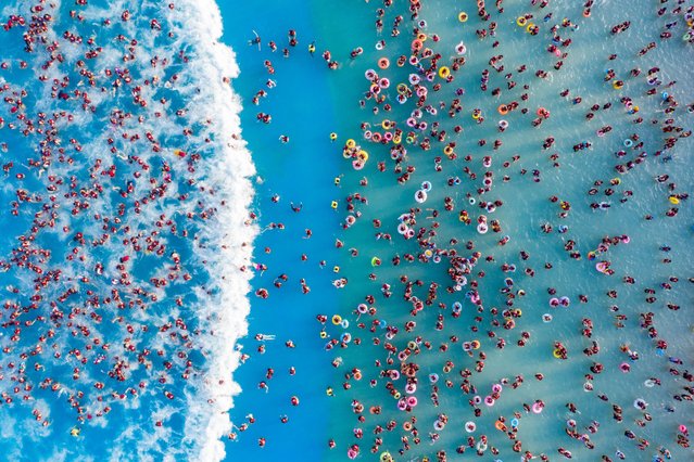 People enjoy a water park in Zhengzhou city in central China's Henan province. Many cities in northern China have reported setting new mid-June records as temperatures stand above 40 degrees Celsius. (Photo credit should read Feature China/Future Publishing via Getty Images)