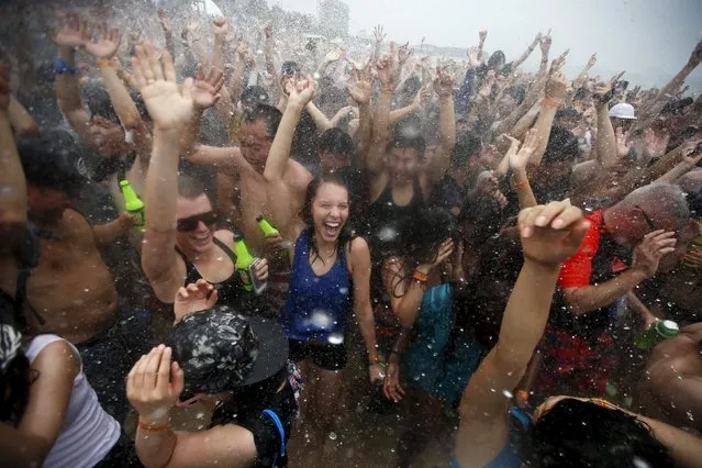 Tourists attend the Boryeong Mud Festival at Daecheon beach in Boryeong, South Korea, July 18, 2015. (Photo by Kim Hong-Ji/Reuters)