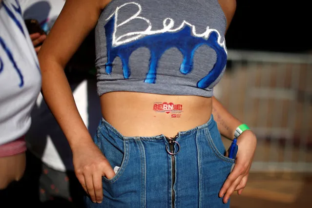 A supporter waits for U.S. Democratic presidential candidate Bernie Sanders to speak in Santa Monica, California, U.S., May 23, 2016. (Photo by Lucy Nicholson/Reuters)