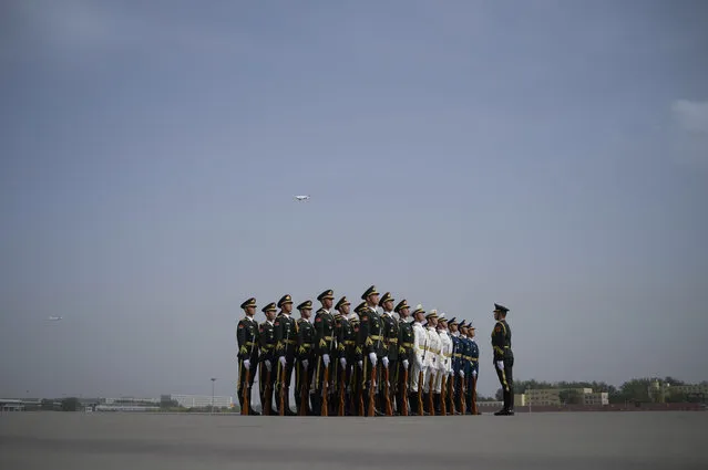 Chinese honour guards prepare for the arrival of Malaysian Prime Minister Najib Razak at Beijing Capital International Airport on May 12,2017. .Najib Razak arrived to take part in the Belt and Road Forum for International Cooperation, which will be held in Beijing from May 14 to 15. (Photo by Wang Zhao/AFP Photo)