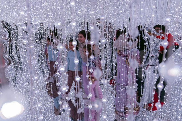 Children visit a Blow Up Experience installation, part of an exhibit of inflatable art and technology, in Montevideo, Uruguay, Friday, August 30, 2024. (Photo by Matilde Campodonico/AP Photo)