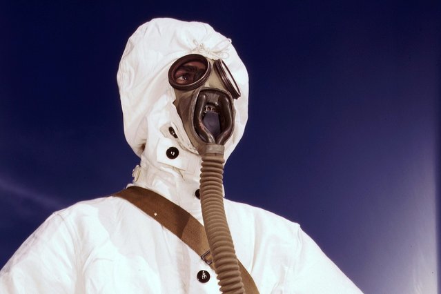 A sailor at the Naval Air Base wears the new type protective clothing and gas mask designed for use in chemical warfare, in Corpus Christi, Texas, in August of 1942