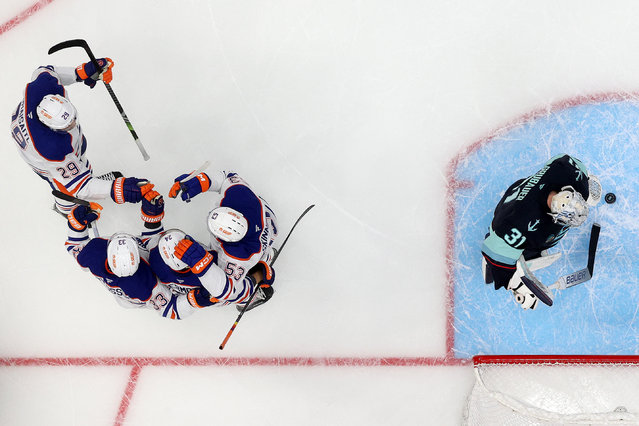 Travis Dermott #24 of the Edmonton Oilers celebrates his goal during the second period against the Philipp Grubauer #31 of the Seattle Kraken at Climate Pledge Arena on October 02, 2024 in Seattle, Washington. (Photo by Steph Chambers/Getty Images/AFP Photo)