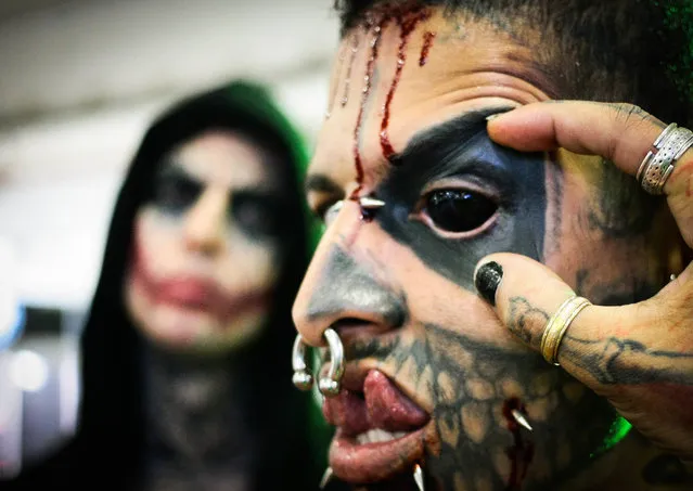 Event goer with split tongue, tattoo's and black eyes during Tattoo Week 2017 Sao Paulo, the 7th edition of Tattoo Week SP at Expo Center Norte on July 14, 2017. (Photo by Imago via ZUMA Press)
