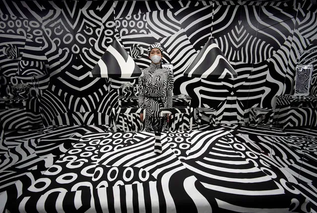 A young woman poses for photographs in Japanese artist Shigeki Matsuyama's art installation “Seen behind watching” during the “rooms 40” fashion and design trade show at Yoyogi National Stadium in Tokyo, Japan, 20 February 2020. “Rooms” is a biannual international fashion and design trade show which presents a wide range of items as well as art installations. (Photo by Franck Robichon/EPA/EFE)