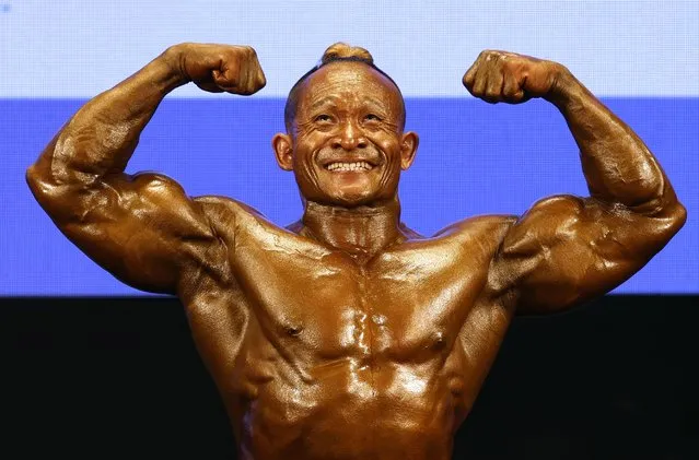 Mg Mg Myint of Myanmar poses in the men’s bodybuilding at the Southeast Asian Games in Hanoi, Vietnam on May 13, 2022. (Photo by Navesh Chitrakar/Reuters)