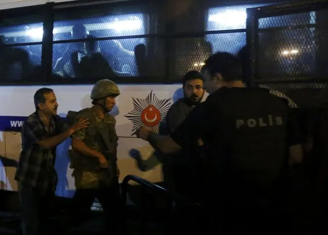 Turkish soldiers surrender to policemen during an attempted coup in Istanbul's Taksim Square, Turkey, July 16, 2016. (Photo by Murad Sezer/Reuters)