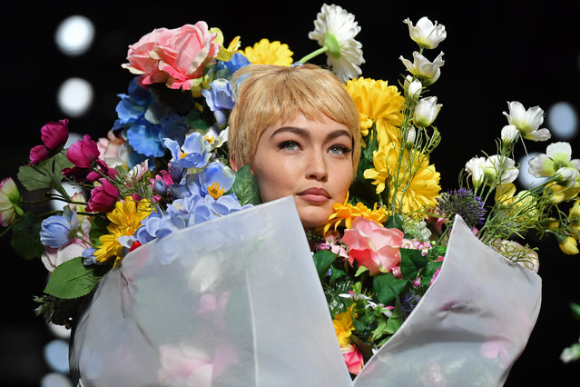 Model Gigi Hadid presents a creation for fashion house Moschino during the Women's Spring/Summer 2018 fashion shows in Milan, on September 21, 2017. (Photo by Marco Bertorello/AFP Photo)