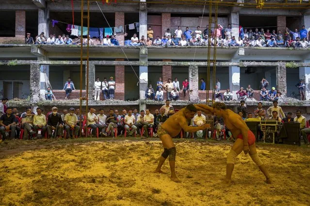 Wrestlers compete at a local fair in Dharmsala, India, Tuesday, September 6, 2022. (Photo by Ashwini Bhatia/AP Photo)