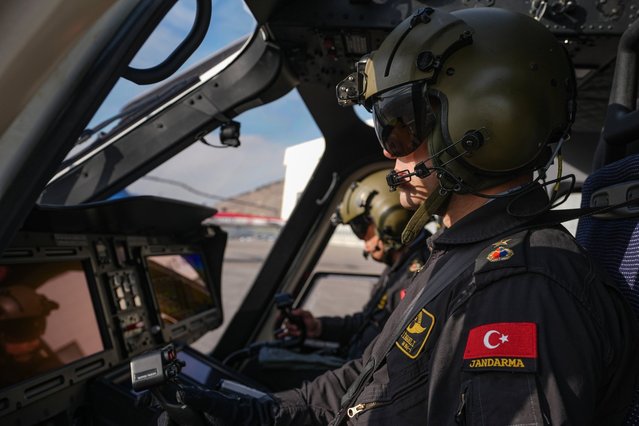 Pilots are seen in the cockpit of the general purpose helicopter Gokbey, produced with local and national resources, with its wide range of possibilities and capabilities in the most challenging missions, in the Turkish capital Ankara on February 10, 2025. Developed to meet the needs of the Turkish Gendarmerie General Command, Gokbey has the opportunity and ability to operate effectively in the most difficult climatic conditions, at high altitude and temperature, day and night. The Gokbey, which can successfully perform tasks such as VIP, cargo, air ambulance, search and rescue and offshore transportation, is in a superior position than its competitors in its class with its features and technology. (Photo by Omer Taha Cetin/Anadolu via Getty Images)