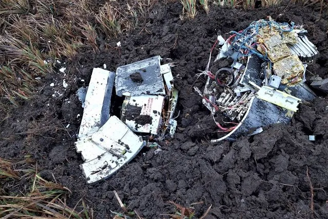 An image released by Moldova's Interior Ministry, shows the remains of a missile in a field in the village of Larga, northern Moldova, Saturday, January 14, 2023. Moldovan authorities said on Saturday that the remains of a rocket “originating from Russia's air attacks on Ukraine” was found by border officials in a northern village near to the country's border with war-torn Ukraine. (Photo by Moldovan Interior Ministry via AP Photo)