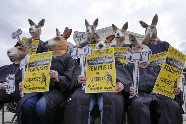 Demonstrators wearing kangaroo masks gather outside the Supreme Court as justices prepare to hear arguments on former President Donald Trump's immunity claims, on Capitol Hill in Washington, April 25, 2024. (Photo by Mariam Zuhaib/AP Photo)