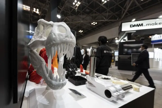A 3D printed skull of a Tyrannosaurus rex by Japanese company Apple Tree Digital Fabrication is pictured at the International Nanotechnology Exhibition and Conference, or Nano Tech 2023, at Tokyo Big Sight in Tokyo on February 3, 2023. (Photo by Richard A. Brooks/AFP Photo)