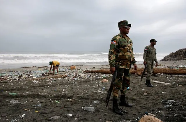 Dominican soldiers patrol the beach of Haina, where strong waves and heavy winds have been registered due to the passage of hurricane Matthew, in Haina, Dominican Republic, October 3, 2016. The government has declared red alert in several provinces and has also suspended classes for three days. (Photo by Orlando Barra/EPA)