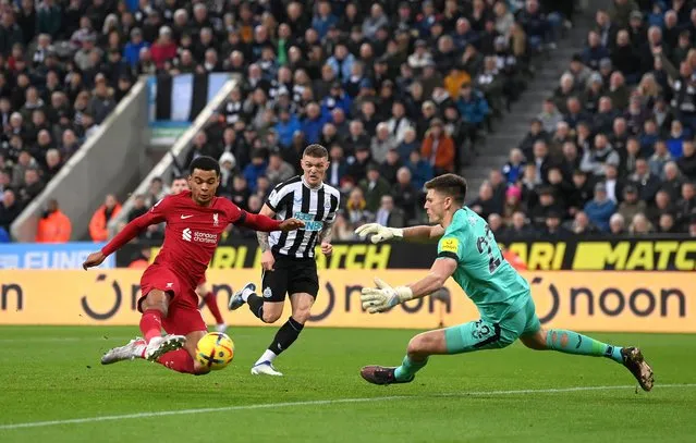 Cody Gakpo of Liverpool scores the team's second goal past Nick Pope of Newcastle United during the Premier League match between Newcastle United and Liverpool FC at St. James Park on February 18, 2023 in Newcastle upon Tyne, England. (Photo by Stu Forster/Getty Images)
