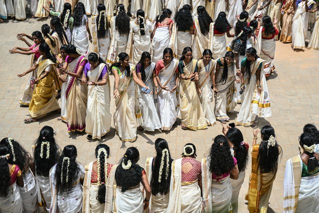 Students perform a traditional dance during the celebrations of Onam, an annual harvest festival, in Chennai on September 4, 2025. (Photo by R.Satish Babu/AFP Photo)