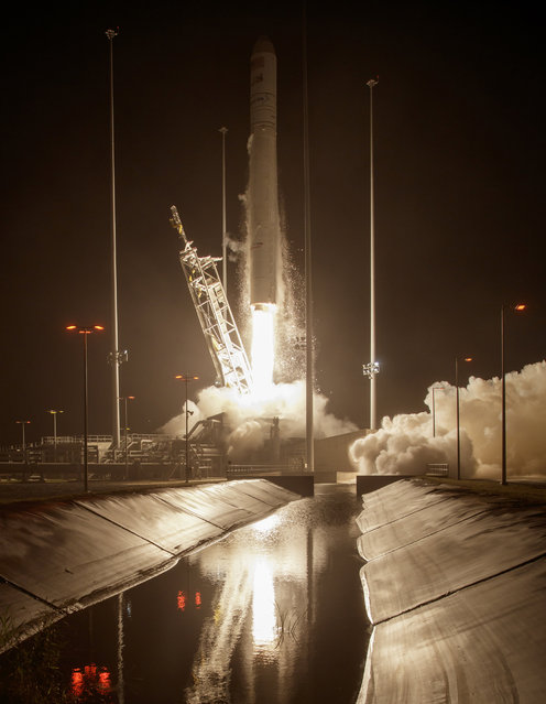 In this handout provided by NASA, the Orbital ATK Antares rocket, with the Cygnus spacecraft onboard, launches from Pad-0A at NASA's Wallops Flight Facility on October 17, 2016 in Wallops Island, Virginia. Orbital ATK's sixth contracted cargo resupply mission with NASA to the International Space Station is delivering over 5,100 pounds of science and research, crew supplies and vehicle hardware to the orbital laboratory and its crew. (Photo by Bill Ingalls/NASA via Getty Images)